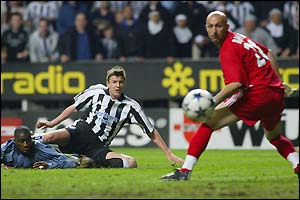 Michael Bridges and Fabien Barthez watch the Newcastle striker's shot go wide