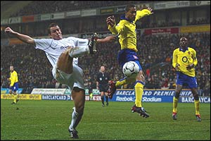 Kevin Davies is challenged by Gael Clichy, who proves an able deputy for Ashley Cole at left-back throughout the season