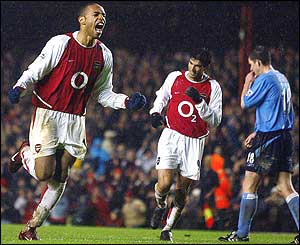 Henry celebrates his curling shot past David James that clinches the victory