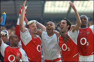 Arsenal celebrate at White Hart Lane