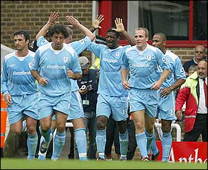 Kevin Davies is challenged by Gilberto