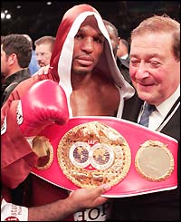 Bernard Hopkins shows off his belt after beating Oscar De La Hoya
