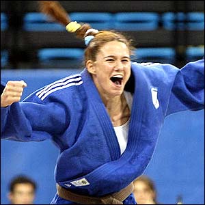Silva celebrates after defeating Ping Lei Li in the judo bout 