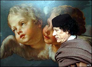 Gaddafi walks past a painting at EU HQ on his way to meet EU leaders