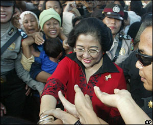 Megawati Sukarnoputri meets voters outside a polling station in Jakarta