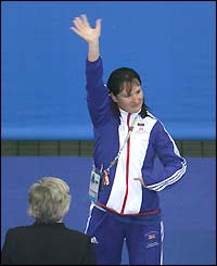 Natalie Jones waves from the podium after winning gold