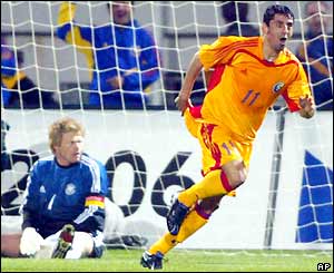 Ionel Danciulescu wheels away after scoring leaving Oliver Kahn on the floor