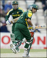 Pakistan's Shoaib Malik takes a quick single with Yasir Hameed