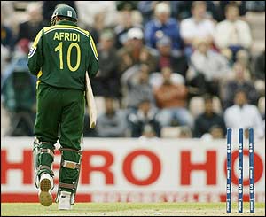 Shahid Afridi leaves the crease after being stumped