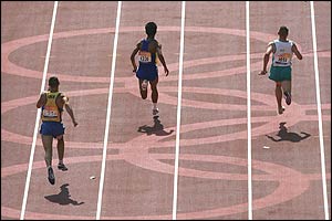 Tim Sullivan (right) brings the baton home for the gold medal