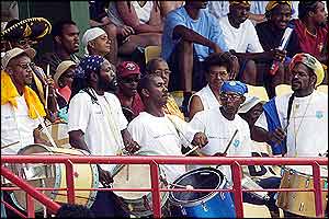 The drums are played in the crowd at the Beausejour Cricket Stadium
