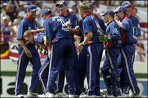 The England team congratulate Paul Collingwood for his impressive catch