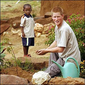 Prince Harry with a young boy in Lesotho