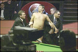 A streaker interrupts the final of the World Snooker Championships