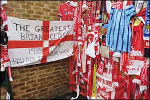 Tributes come from one of Forest's biggest rivals - a Leicester City scarf is seen among the collection