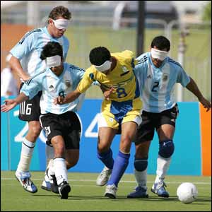 Brazil's Severino Silva (centre) gets tackled in the 5-a-side B1 gold medal match