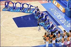 The GB basketball team celebrate their bronze medals on the podiums