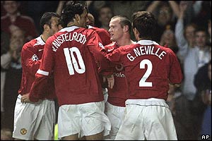 Wayne Rooney's team-mates celebrate his opening strike