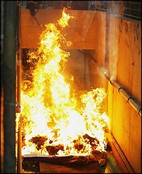 The game is stopped while a fire at one end of the stadium is dealt with