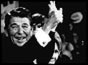Ronald Reagan waving to crowd