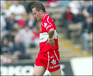 Padraig O'Kane walks off the field after his sending off