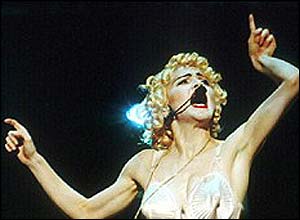 Madonna performing during one of her world tours in the early 1990s