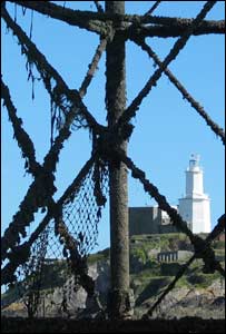 Mumbles lighthouse as seen from beneath pier, by Jim Young