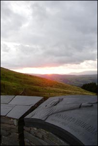 Sunset from the Wynford Vaughan Thomas memorial on the mountain road between Machynlleth and Llanidloes, from Royston Jones.