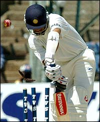 McGrath sneaks one through Rahul Dravid's defences