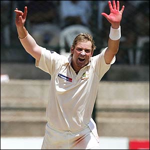 Shane Warne celebrates the wicket of Pathan