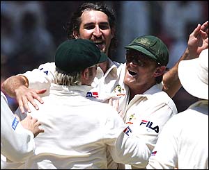Jason Gillespie celebrates his wicket of Patel