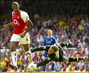 Patrick Vieira goes past Ian Walker to score