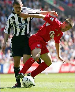 Michael Owen holds off Newcastle's Andrew Griffin