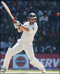 Adam Gilchrist cuts the ball for four