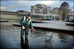 The final touches are put to the area around Holyrood in advance of the formal opening by the Queen on Saturday
