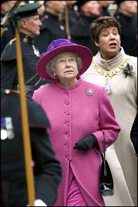 Outside, something above the Royal Mile catches the Queen's attention as she heads for a dais from which to watch the Riding