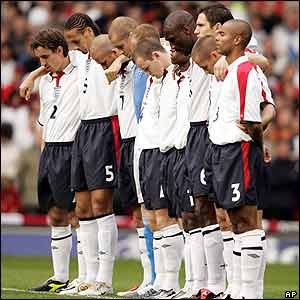 England's players observe a minute's silence