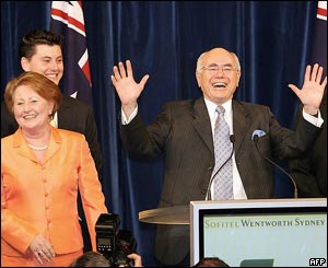 Australian Prime Minister John Howard (r) celebrates his fourth election victory