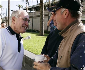 Australian Prime Minister John Howard (l) is wished well for the federal election. 