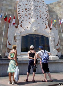 Three women look at the names on the Bali Bombing Memorial