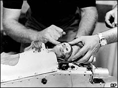 Monkey Able strapped into capsule