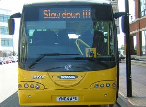 Revolving signs on top of Newport's school coach