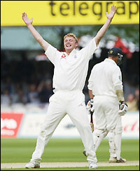 Andrew Flintoff celebrates his first wicket of the match