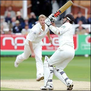 Andrew Flintoff sees his delivery sent into the stands by Cairns