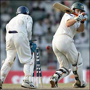 Adam Gilchrist, one of Australia's main threats, is beaten by the spin of Kumble shortly before stumps