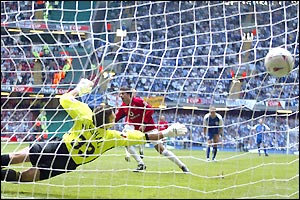 Ruud van Nistelrooy effectively ends the contest when he scores from the penalty spot after Giggs had been fouled