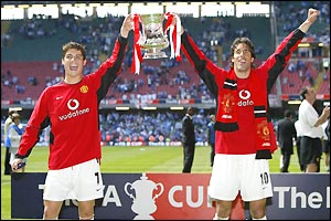 Man Utd's delighted goalscoring heroes Ronaldo and van Nistelrooy show off the silverware