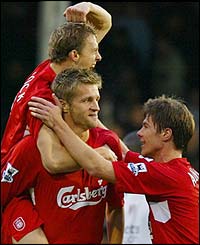 Liverpools players surround goalscorer Igor Biscan 