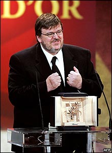 US director Michael Moore accepts the Palme d'Or
