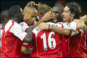 Arsenal's players celebrate Pires's second goal of the game